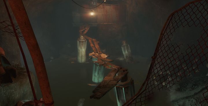 Crossing the board bridge, you find a locked door in Nuka World